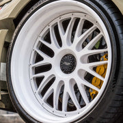 Porsche 911 992 GT3 RS on AL13 C008T forged wheels in Gloss Tesora White finish