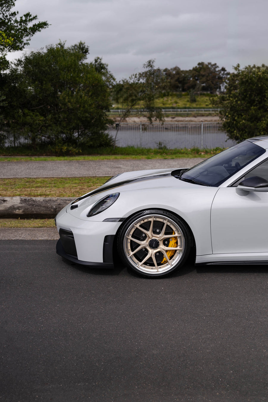 Porsche 911 992.2 GT3 on AL13 D004 forged wheels in Brushed Satin Competition Gold / Polished Gloss finish